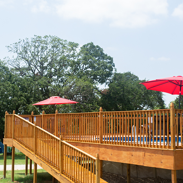 Peaceful RV sites surrounded by trees at Queen & Duke RV Resort in Whitesboro, Texas